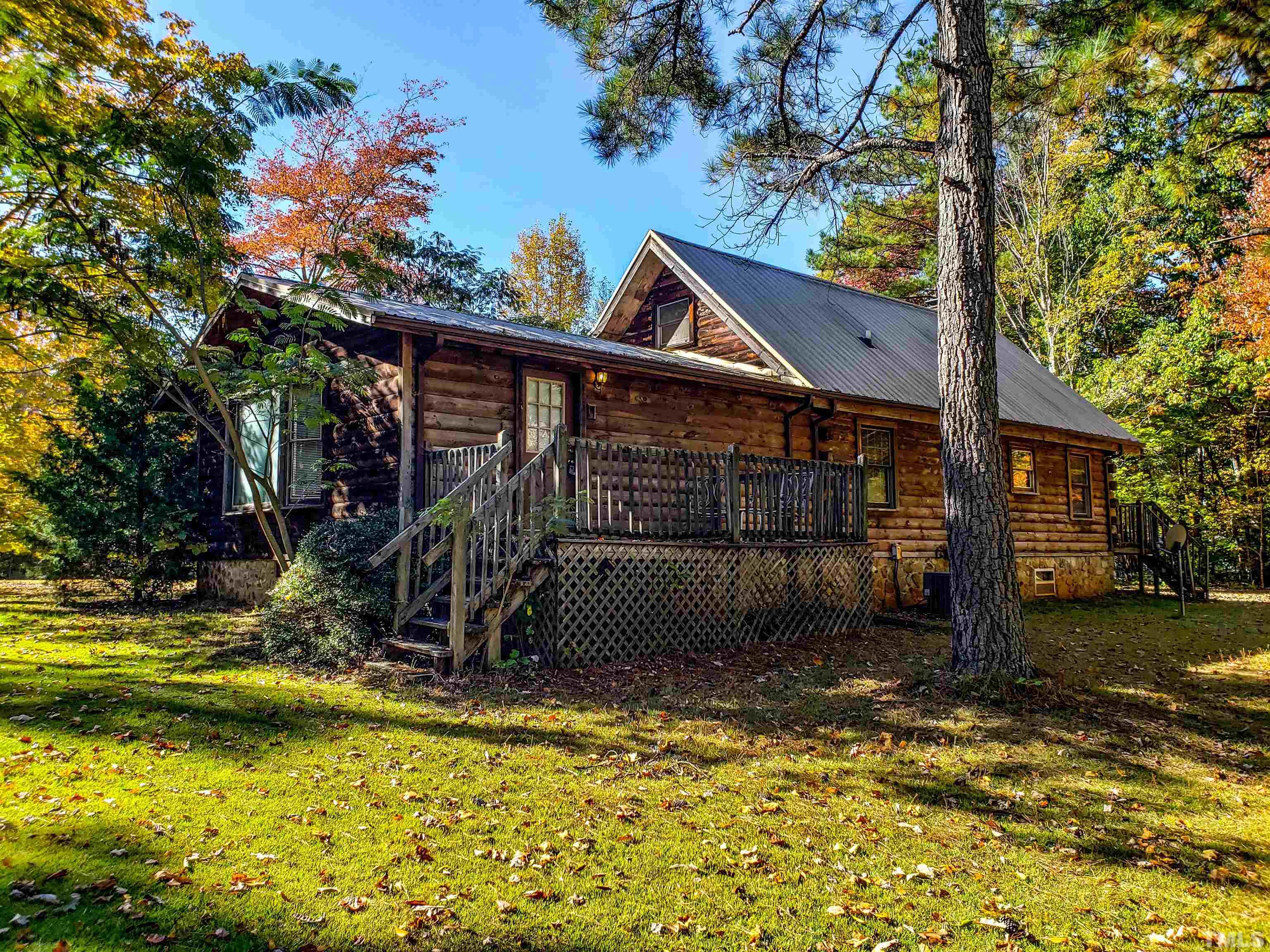 412 Shiloh Church Road Roxboro, NC 27574 - Photo 23 of 30 a view of a house with backyard porch and sitting area