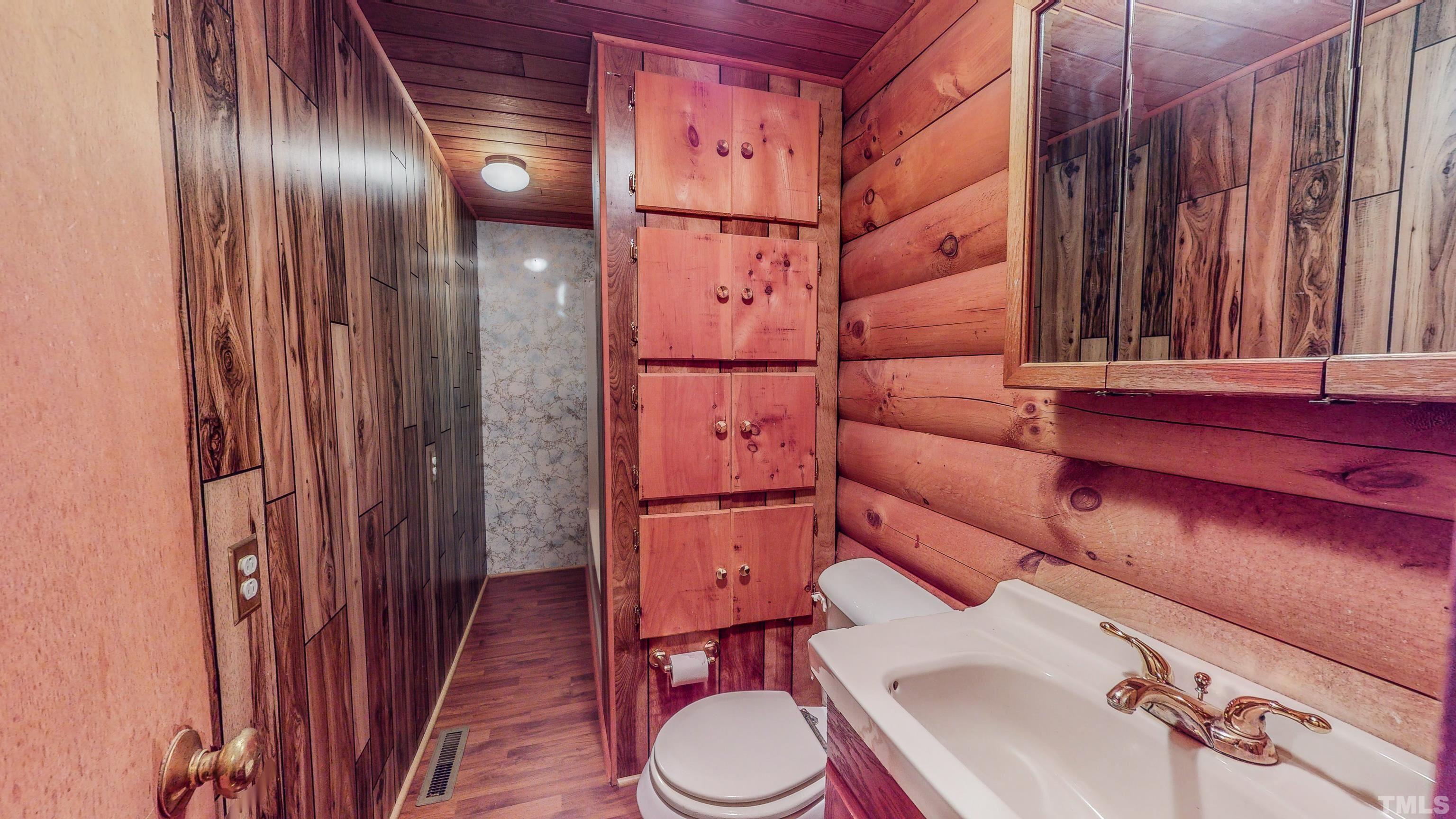 412 Shiloh Church Road Roxboro, NC 27574 - Photo 27 of 30 a bathroom with a toilet and a shower