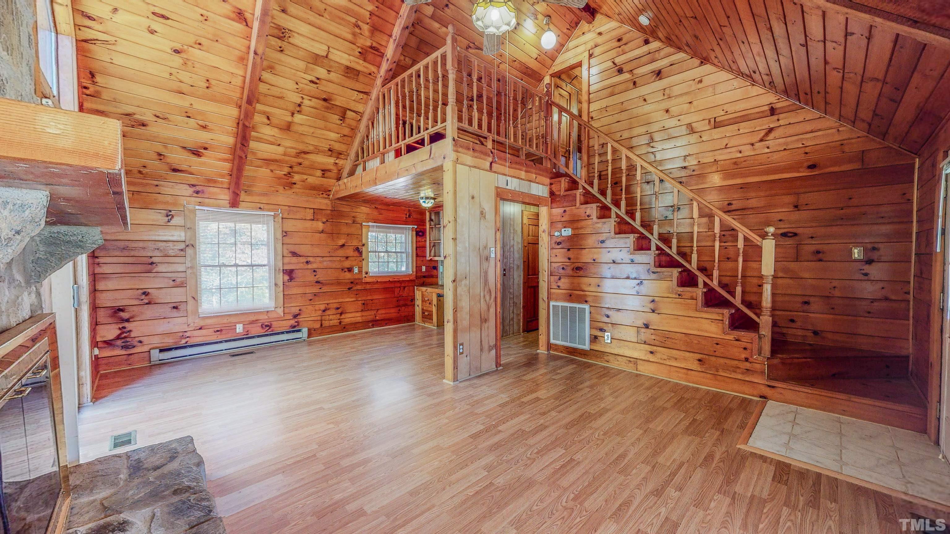 412 Shiloh Church Road Roxboro, NC 27574 - Photo 5 of 30 a view of an empty room with stairs