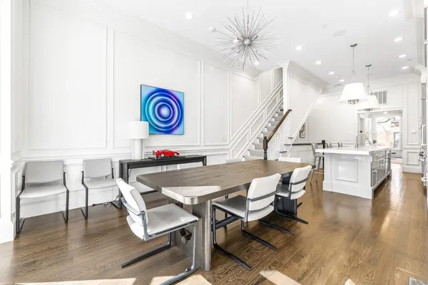 a workspace with furniture and a large window