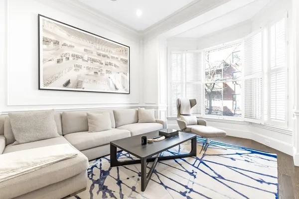 a living room with furniture fireplace and flat screen tv