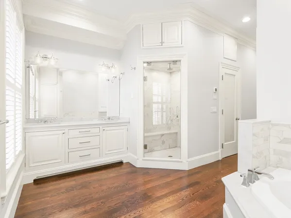 a bathroom with a bathtub and a window