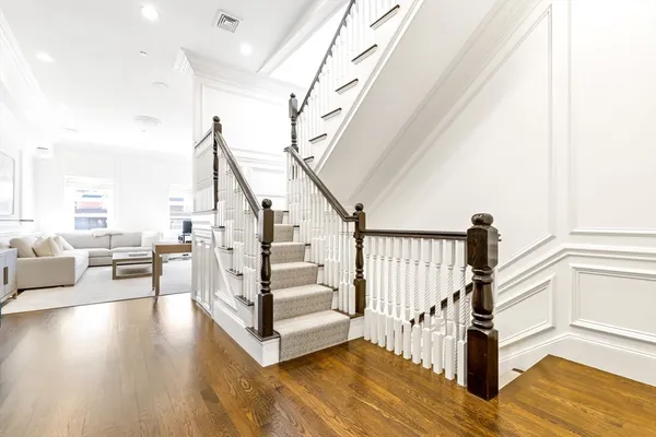 a kitchen with stainless steel appliances granite countertop a stove and a refrigerator