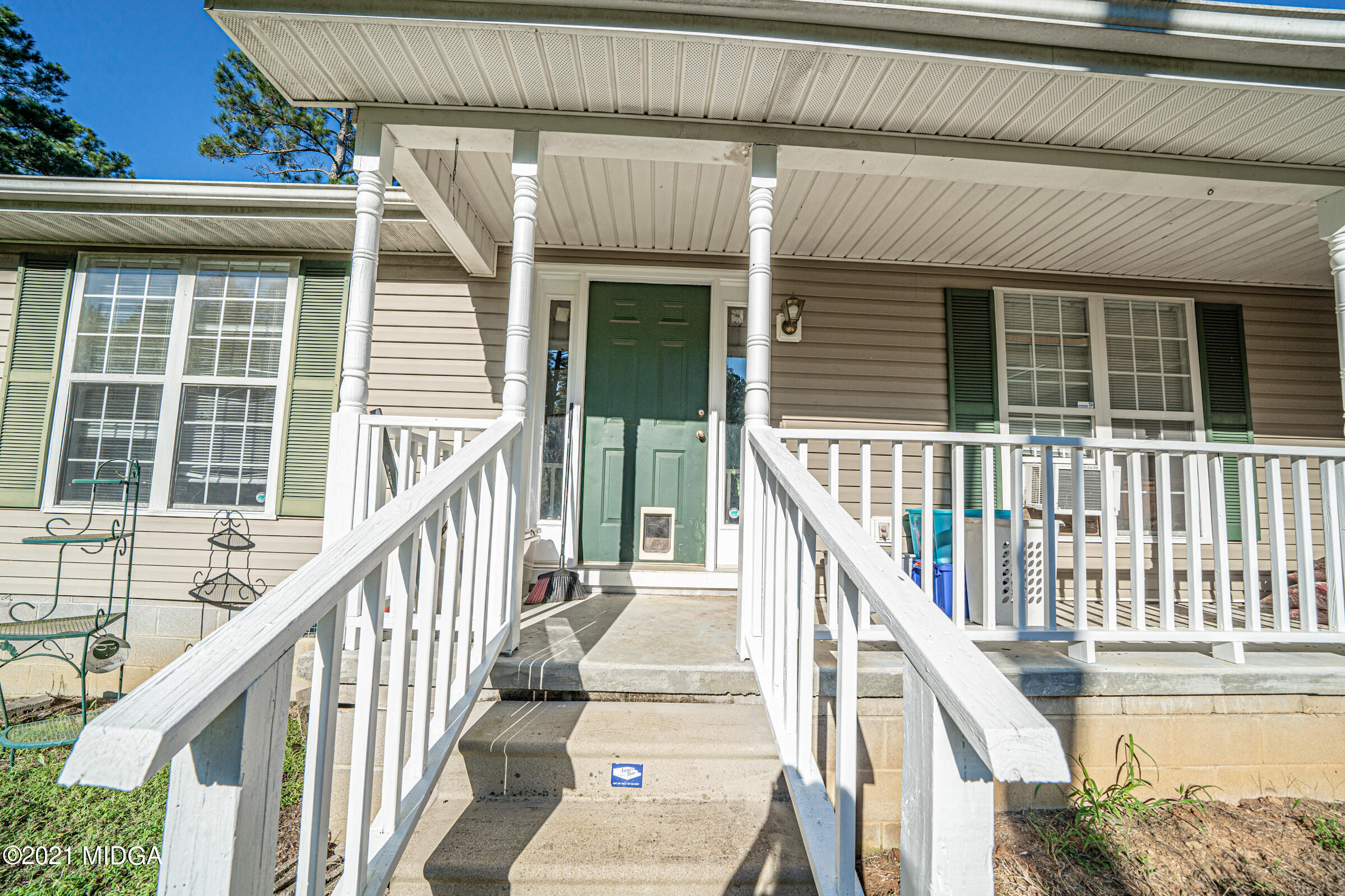 239 Plantation Road Gray, GA 31032 - Photo 3 of 28 a view of balcony with wooden floor and white walls