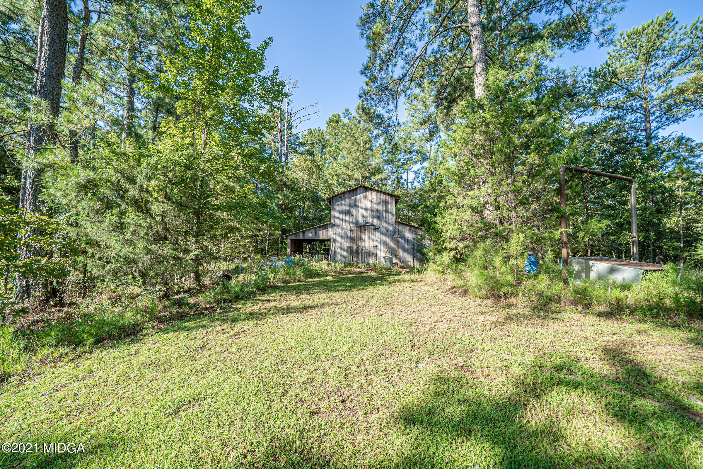 239 Plantation Road Gray, GA 31032 - Photo 24 of 28 a view of a yard with a tree