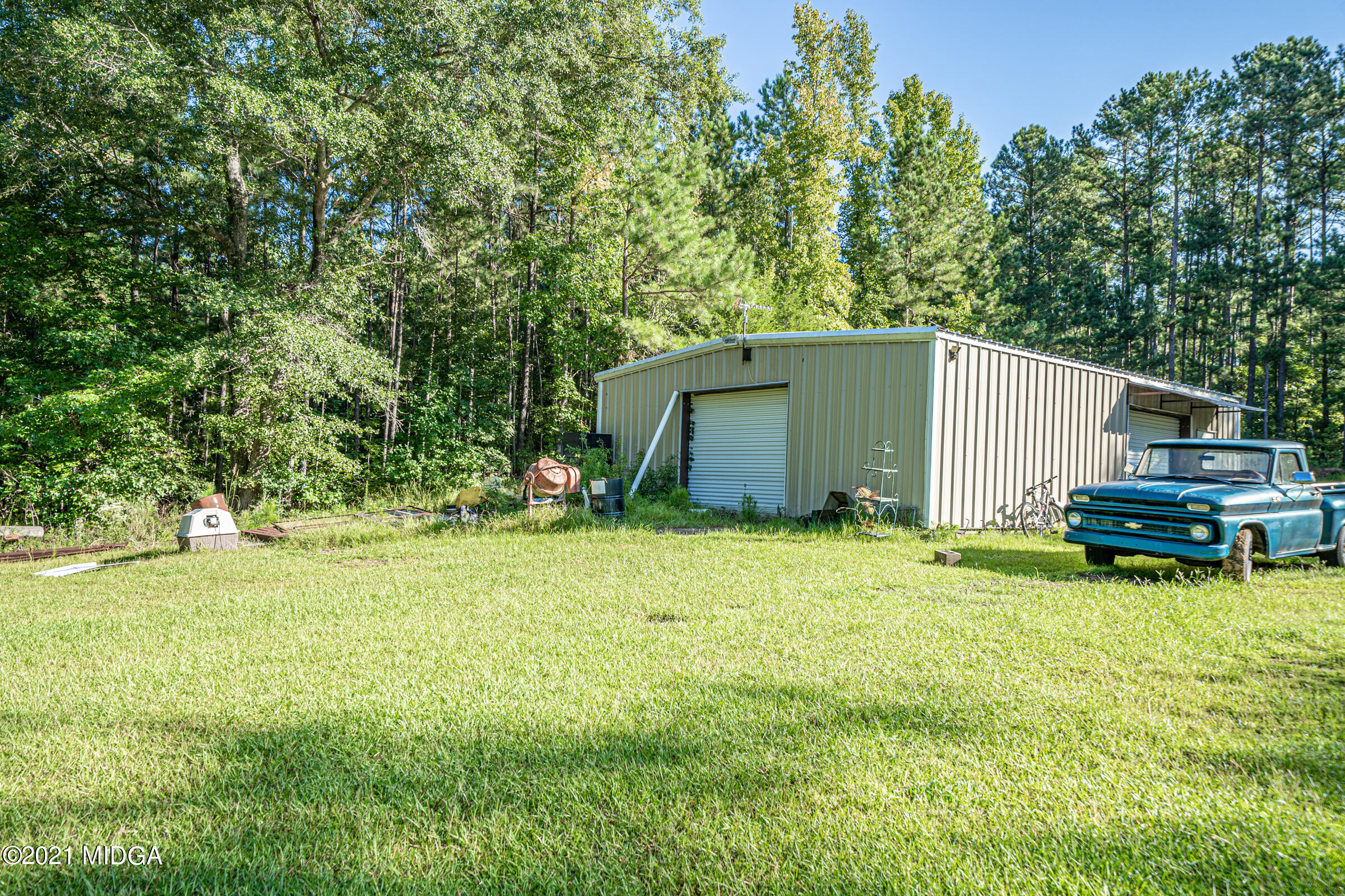 239 Plantation Road Gray, GA 31032 - Photo 28 of 28 a backyard of a house with yard and trees