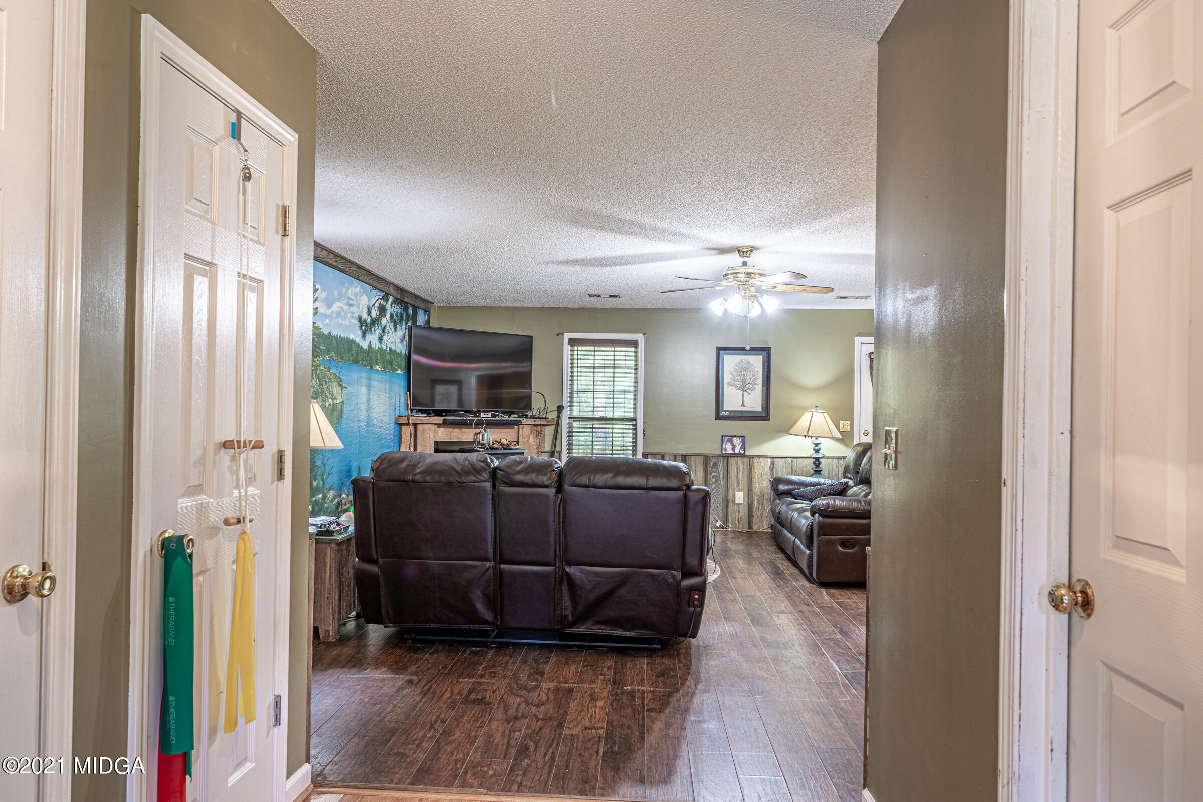 239 Plantation Road Gray, GA 31032 - Photo 4 of 28 a living room with furniture and a wooden floor