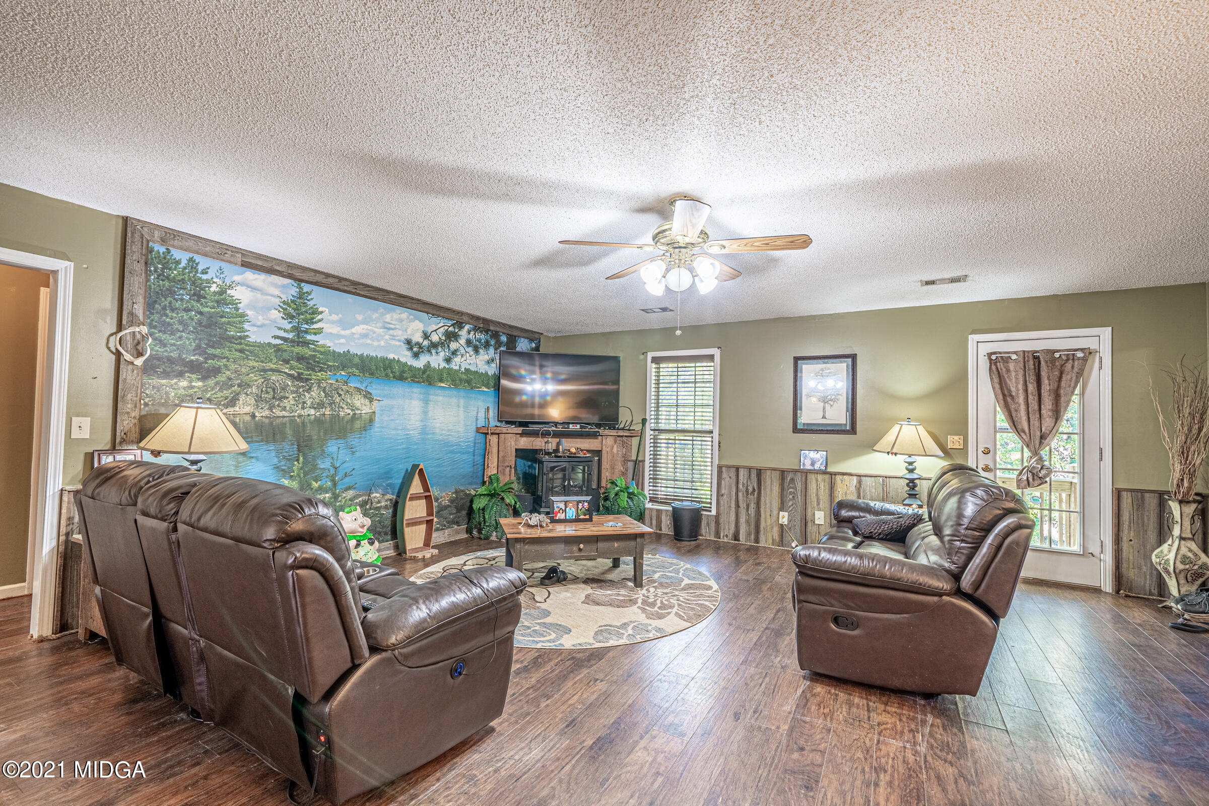 239 Plantation Road Gray, GA 31032 - Photo 5 of 28 a living room with furniture and wooden floor