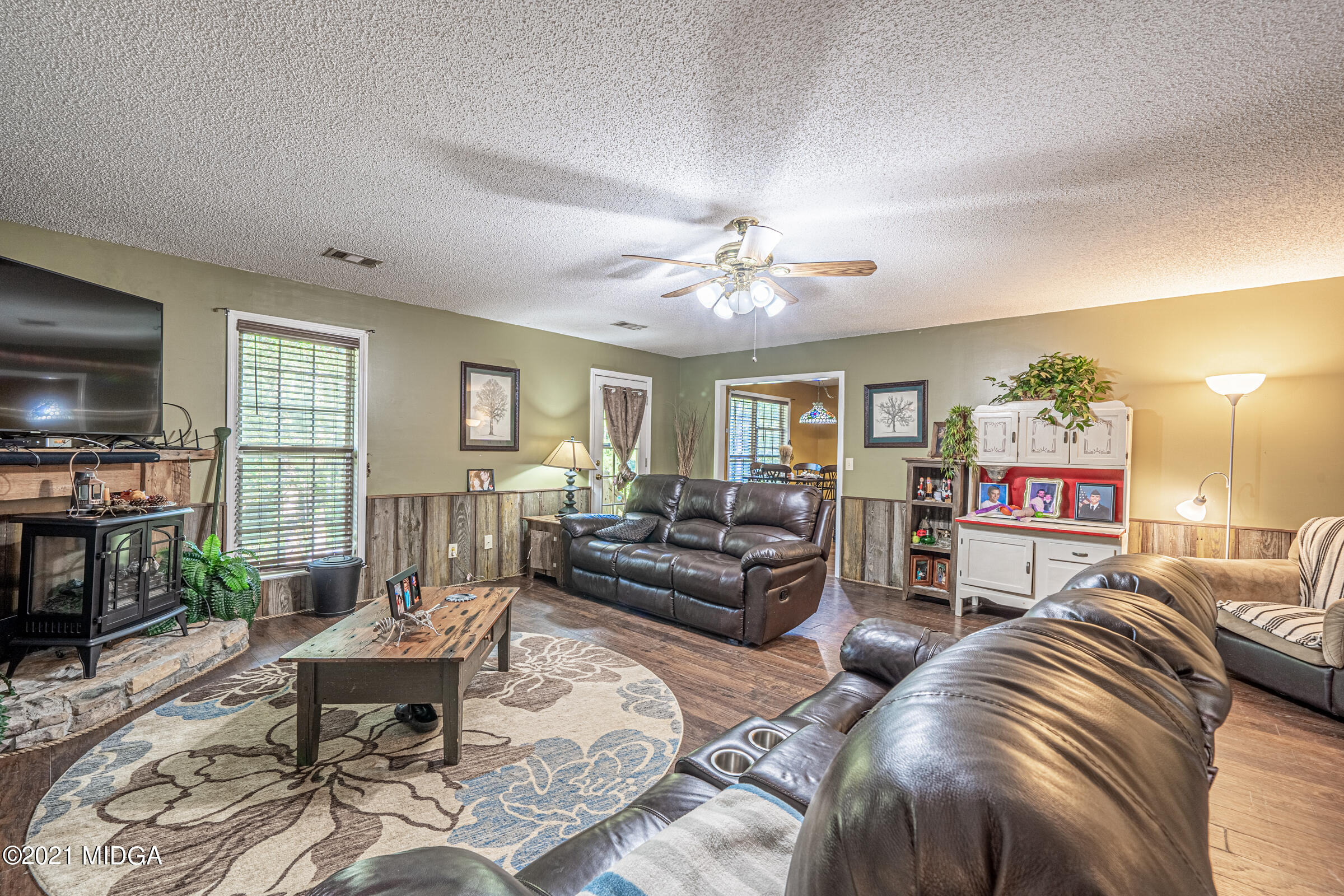 239 Plantation Road Gray, GA 31032 - Photo 8 of 28 a living room with furniture and a flat screen tv