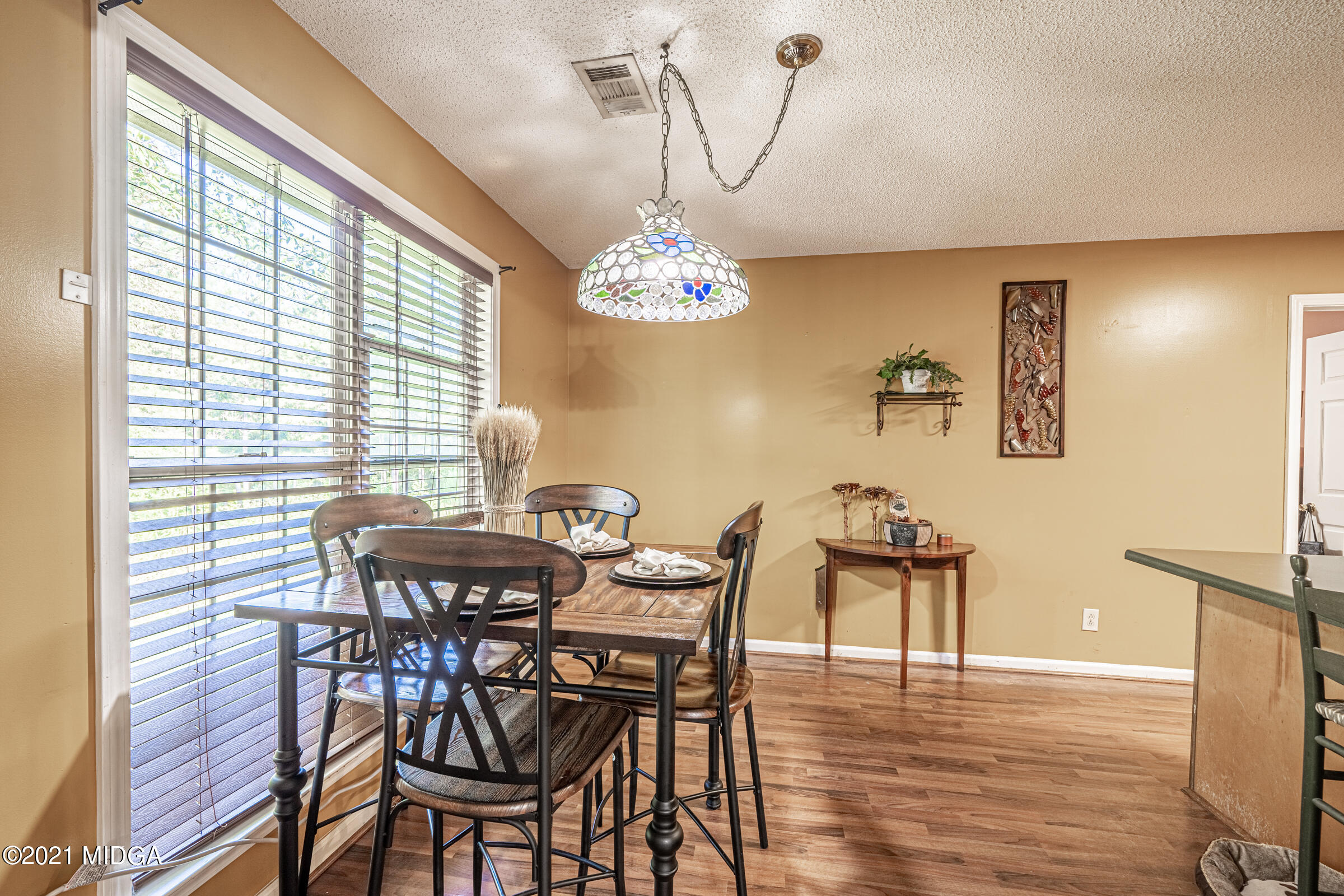 239 Plantation Road Gray, GA 31032 - Photo 9 of 28 a dining room with furniture and window