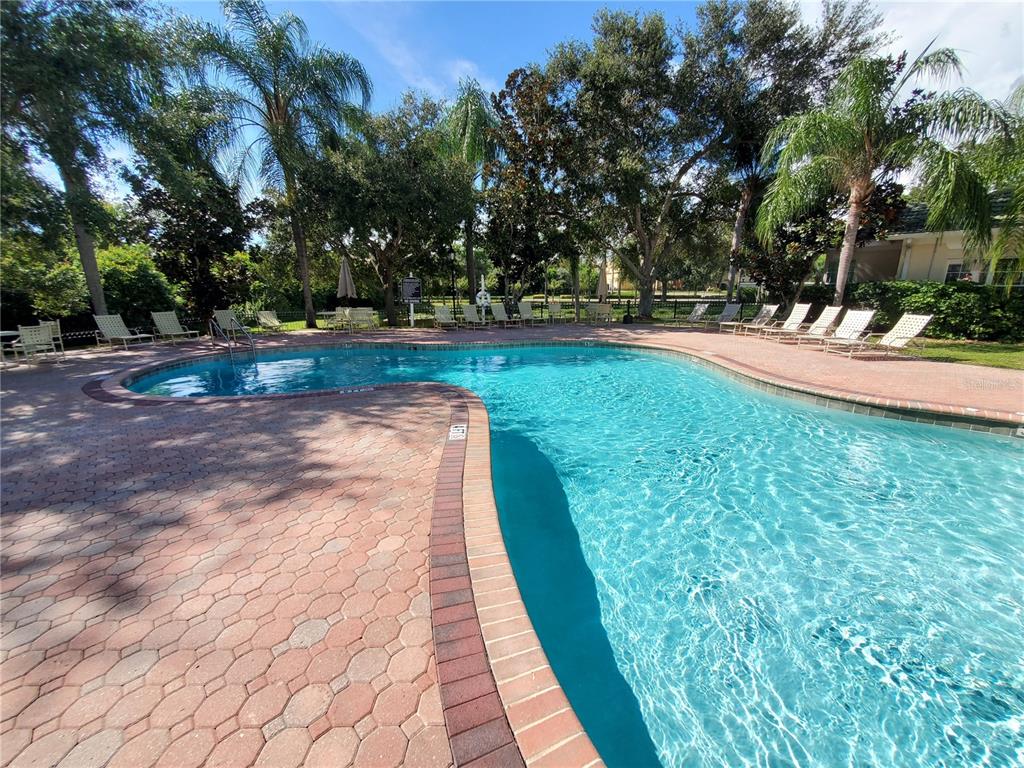 5174 Northridge Road, Unit 209 Sarasota, FL 34238 - Photo 20 of 25 a view of yard with swimming pool and sitting area