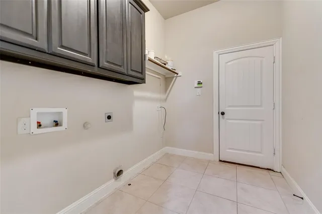 a view of storage and utility room with closet