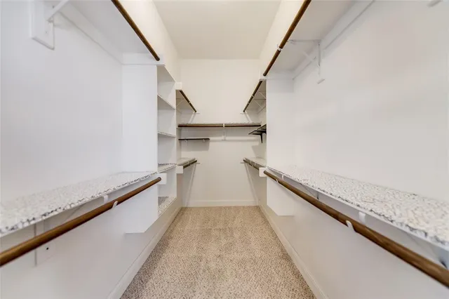 a view of a room with wooden floor and stairs