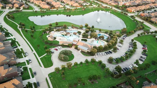 an aerial view of a swimming pool and mountain
