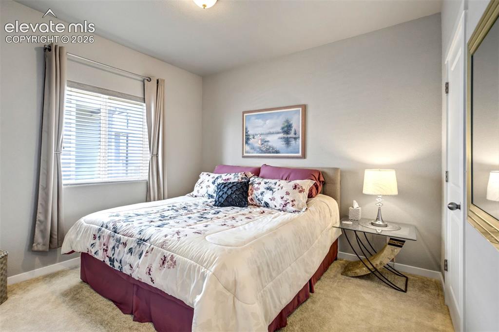 11321 Method Point Peyton, CO 80831 - Photo 28 of 47 2nd bedroom shown with a king-sized bed