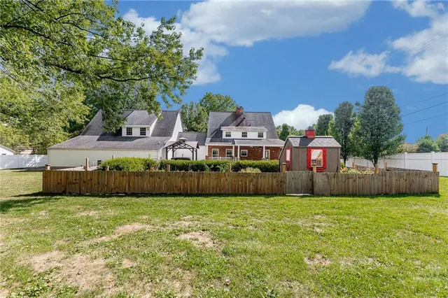 a view of a house with a big yard