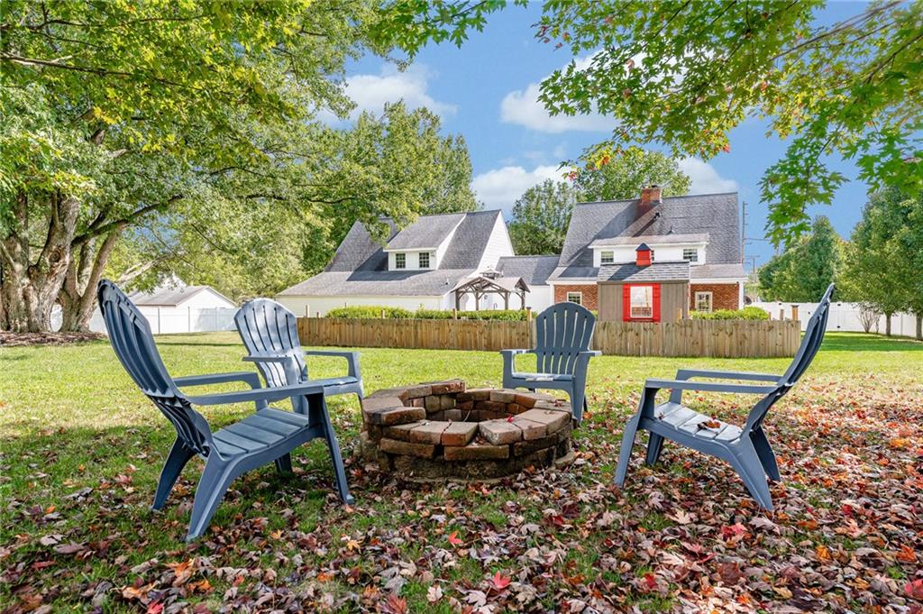 200 Balsinger Road Uniontown, PA 15401 - Photo 16 of 50 a swimming pool with outdoor seating and trees