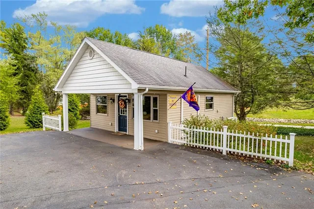 a front view of a house with a porch