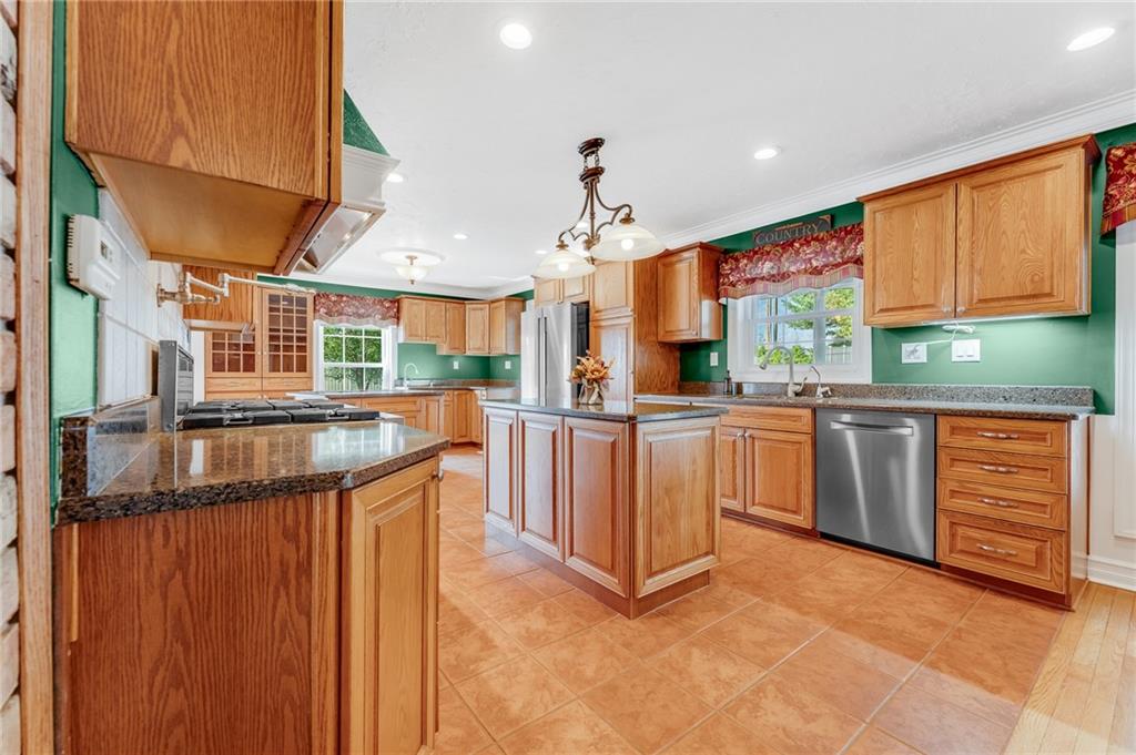 200 Balsinger Road Uniontown, PA 15401 - Photo 29 of 50 a kitchen with stainless steel appliances granite countertop a stove a sink and a refrigerator