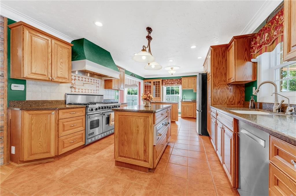 200 Balsinger Road Uniontown, PA 15401 - Photo 30 of 50 a kitchen with granite countertop a sink stove and refrigerator
