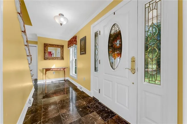 a view of a hallway view with wooden floor and staircase