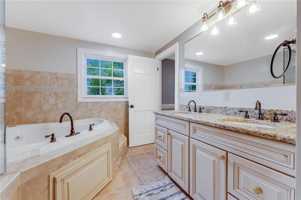 200 Balsinger Road Uniontown, PA 15401 - Photo 42 of 50 a bathroom with a sink double vanity and a tub
