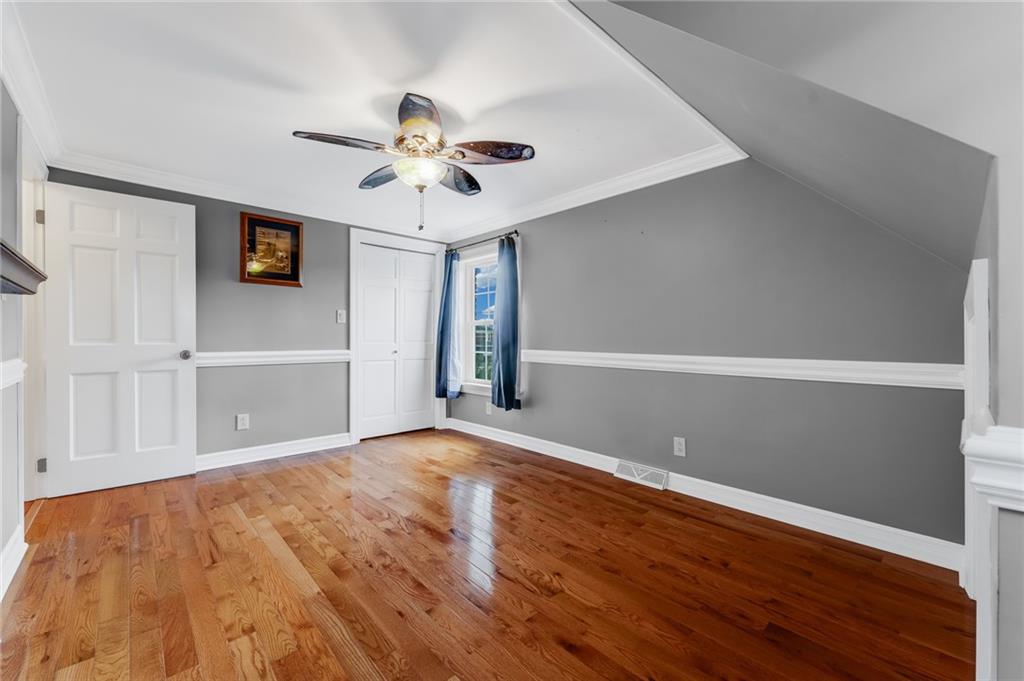 200 Balsinger Road Uniontown, PA 15401 - Photo 45 of 50 a view of an empty room with wooden floor and a ceiling fan