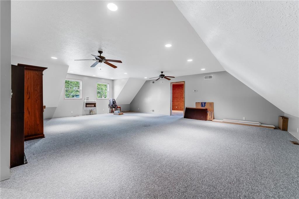 200 Balsinger Road Uniontown, PA 15401 - Photo 48 of 50 an empty room with a ceiling fan and windows