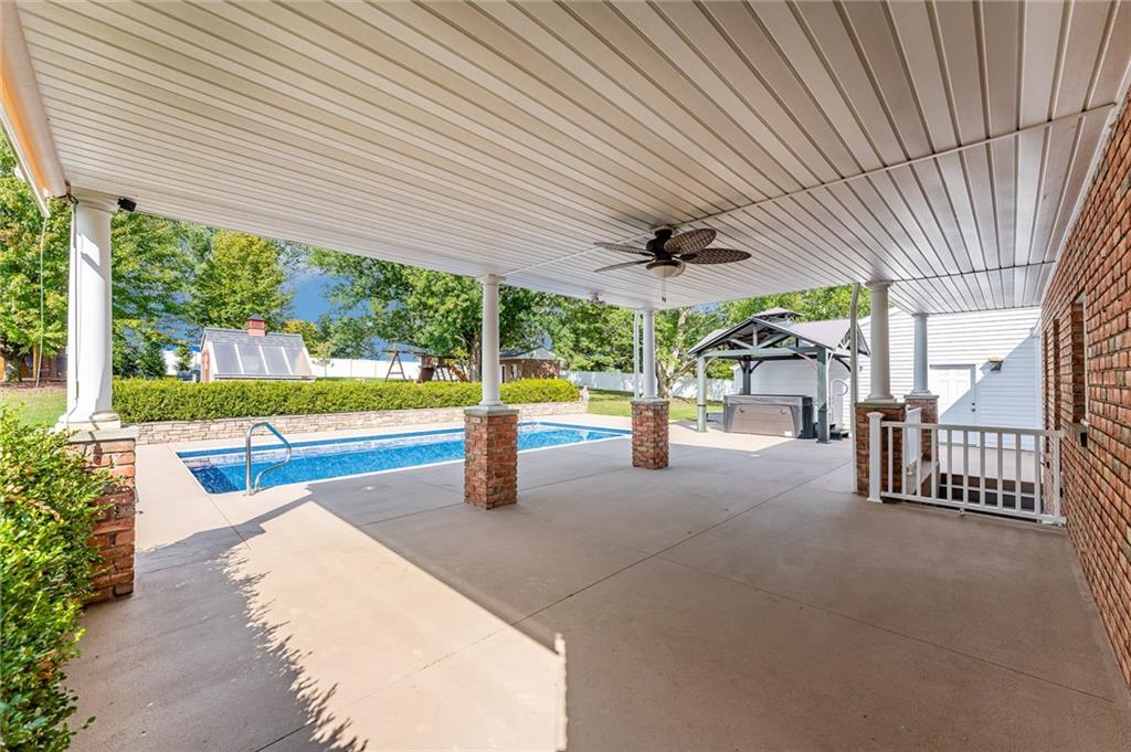 200 Balsinger Road Uniontown, PA 15401 - Photo 9 of 50 a view of a patio with a table chairs and a backyard