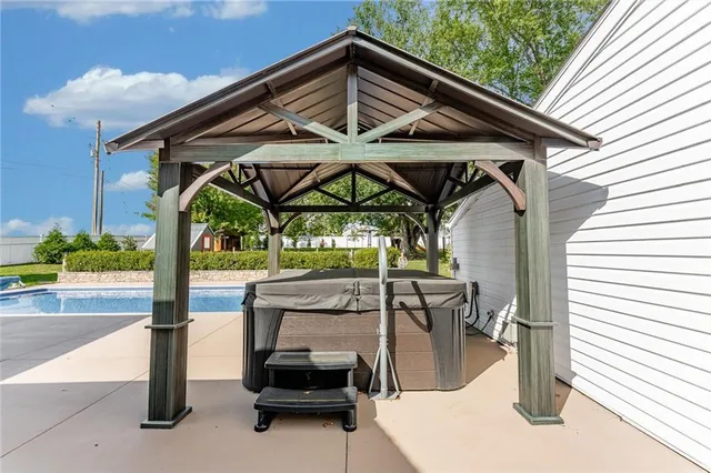 a view of a chairs and table in the patio