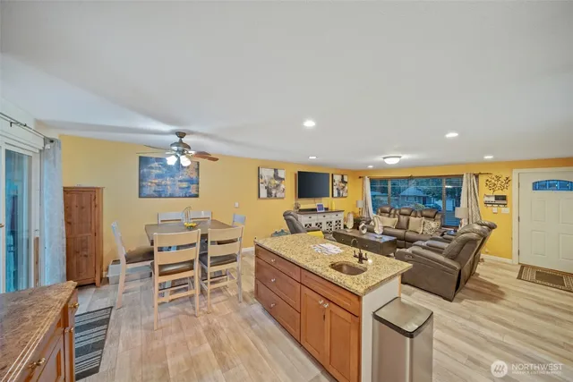 a view of a dining room with furniture window and wooden floor