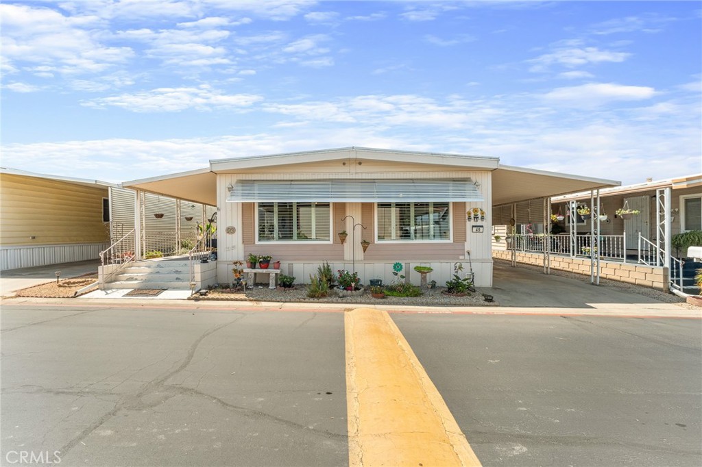 975 California Street, Unit 49 Calimesa, CA 92320 - Photo 2 of 31 a view of a house with outdoor space and sitting area