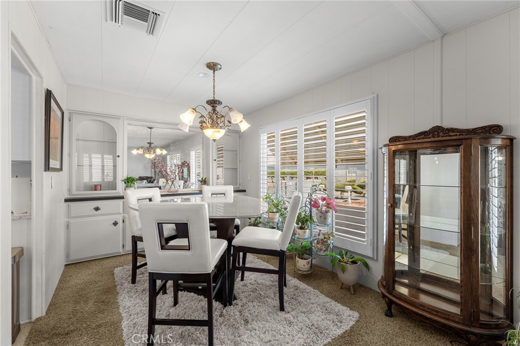 975 California Street, Unit 49 Calimesa, CA 92320 - Photo 8 of 31 a view of a dining room with furniture window and outside view