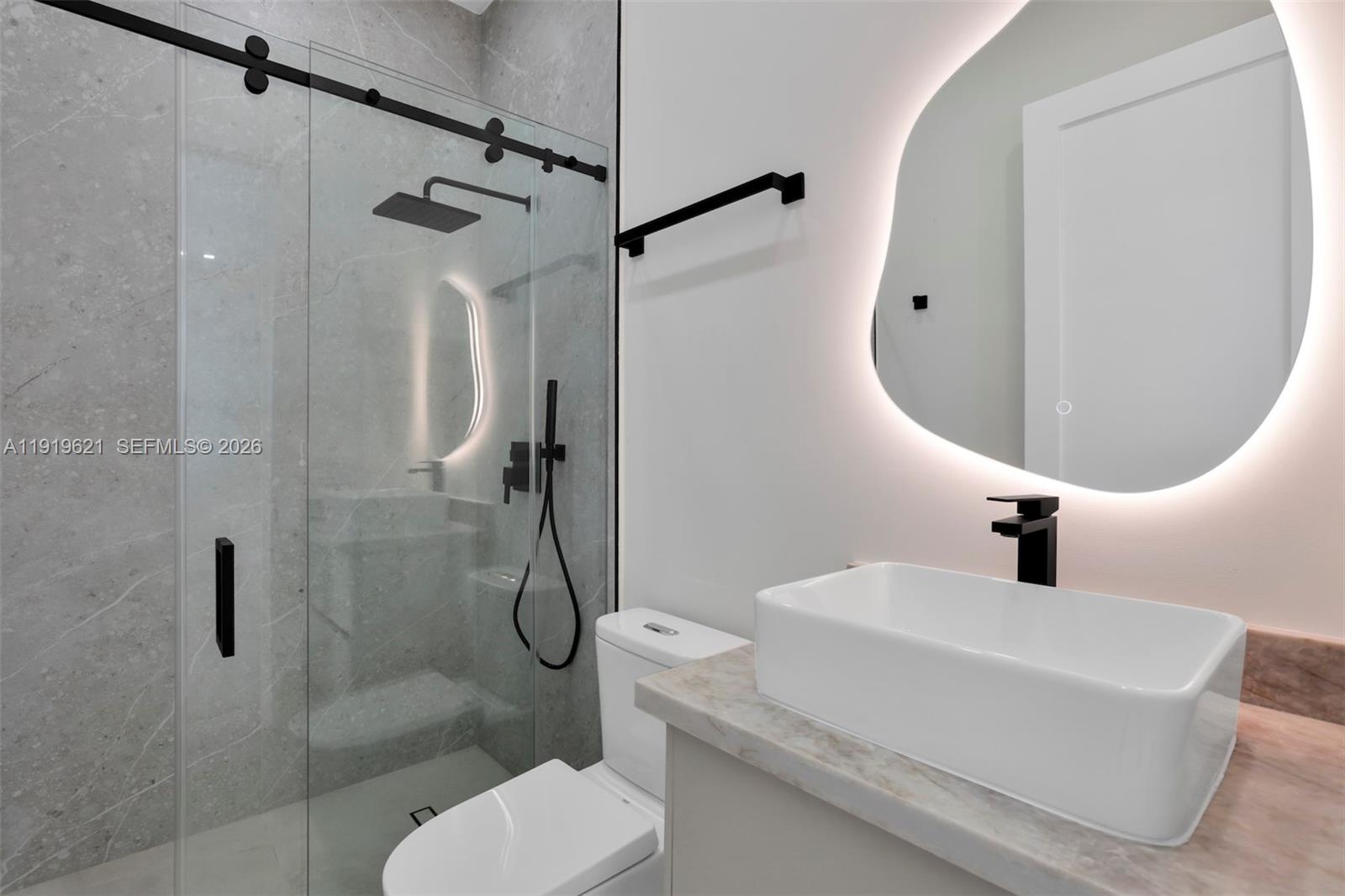 2324 Southwest 26th Street Miami, FL 33133 - Photo 11 of 14 a bathroom with a sink toilet and shower