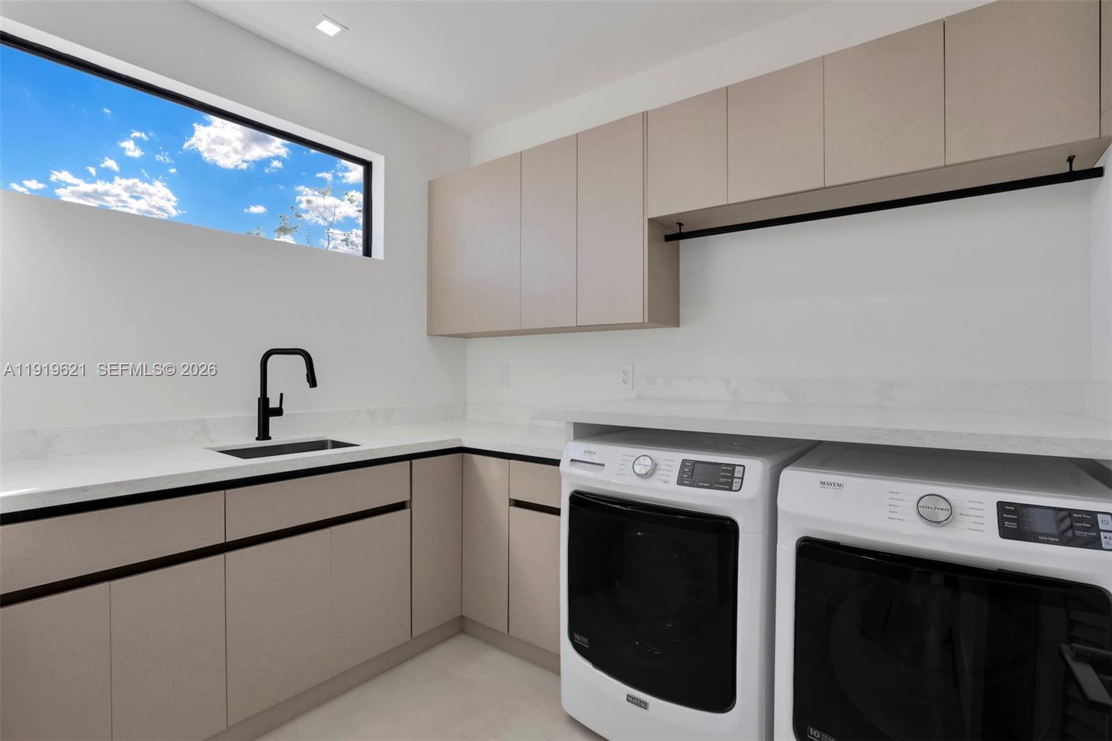 2324 Southwest 26th Street Miami, FL 33133 - Photo 12 of 14 a view of a kitchen with sink and washing machine