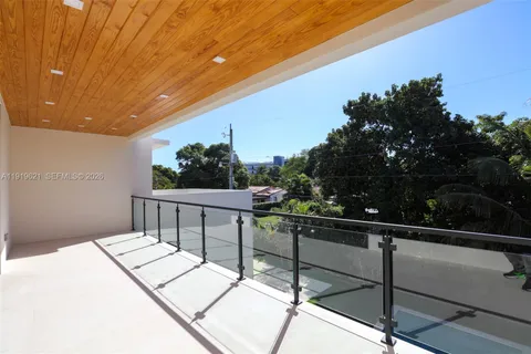 a view of a balcony with chairs