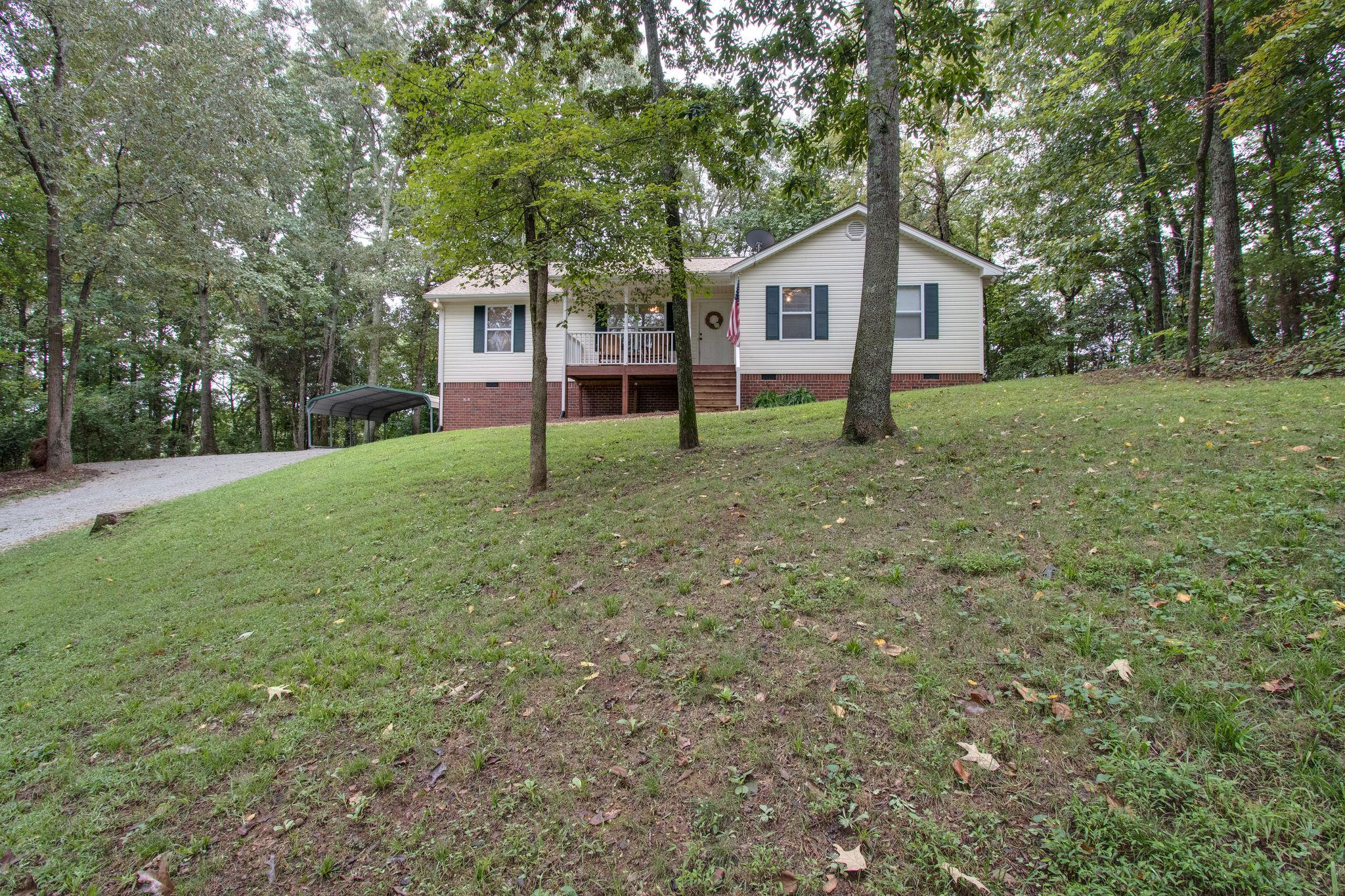 2010 Belotes Ferry Road Lebanon, TN 37087 - Photo 1 of 27 a house with green field in front of it