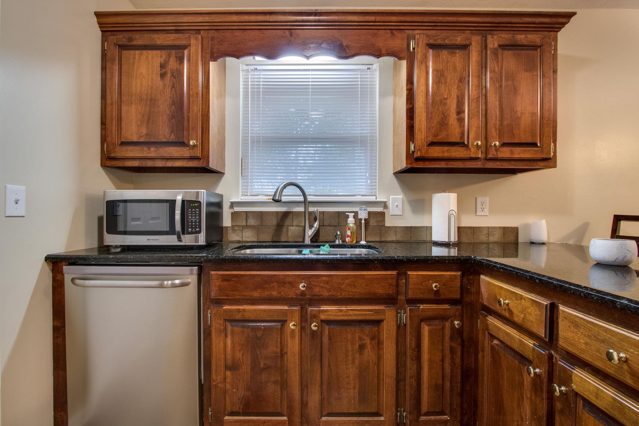 2010 Belotes Ferry Road Lebanon, TN 37087 - Photo 13 of 27 a kitchen with stainless steel appliances granite countertop a sink and cabinets