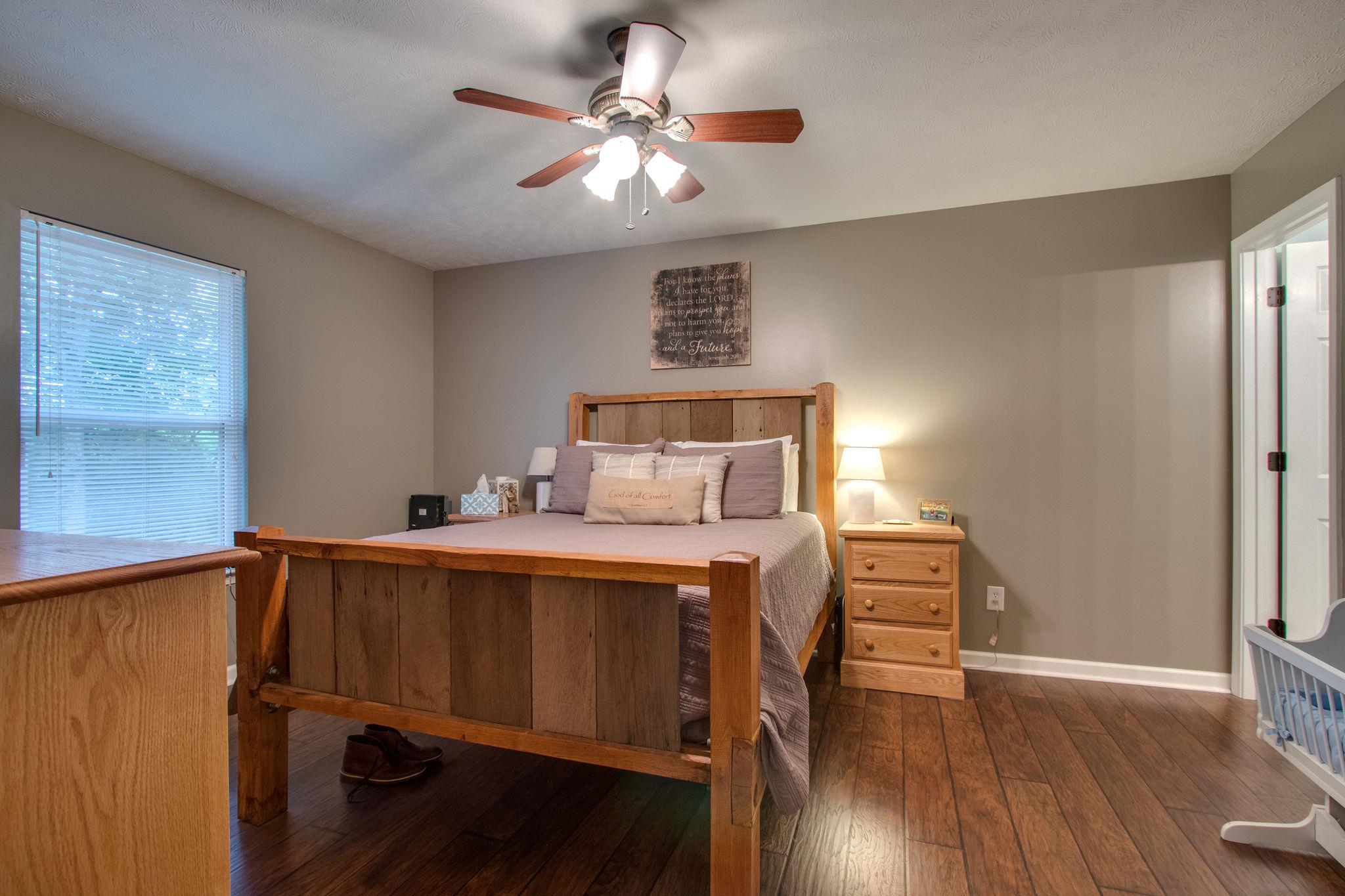 2010 Belotes Ferry Road Lebanon, TN 37087 - Photo 16 of 27 a bedroom with a bed and wooden floor