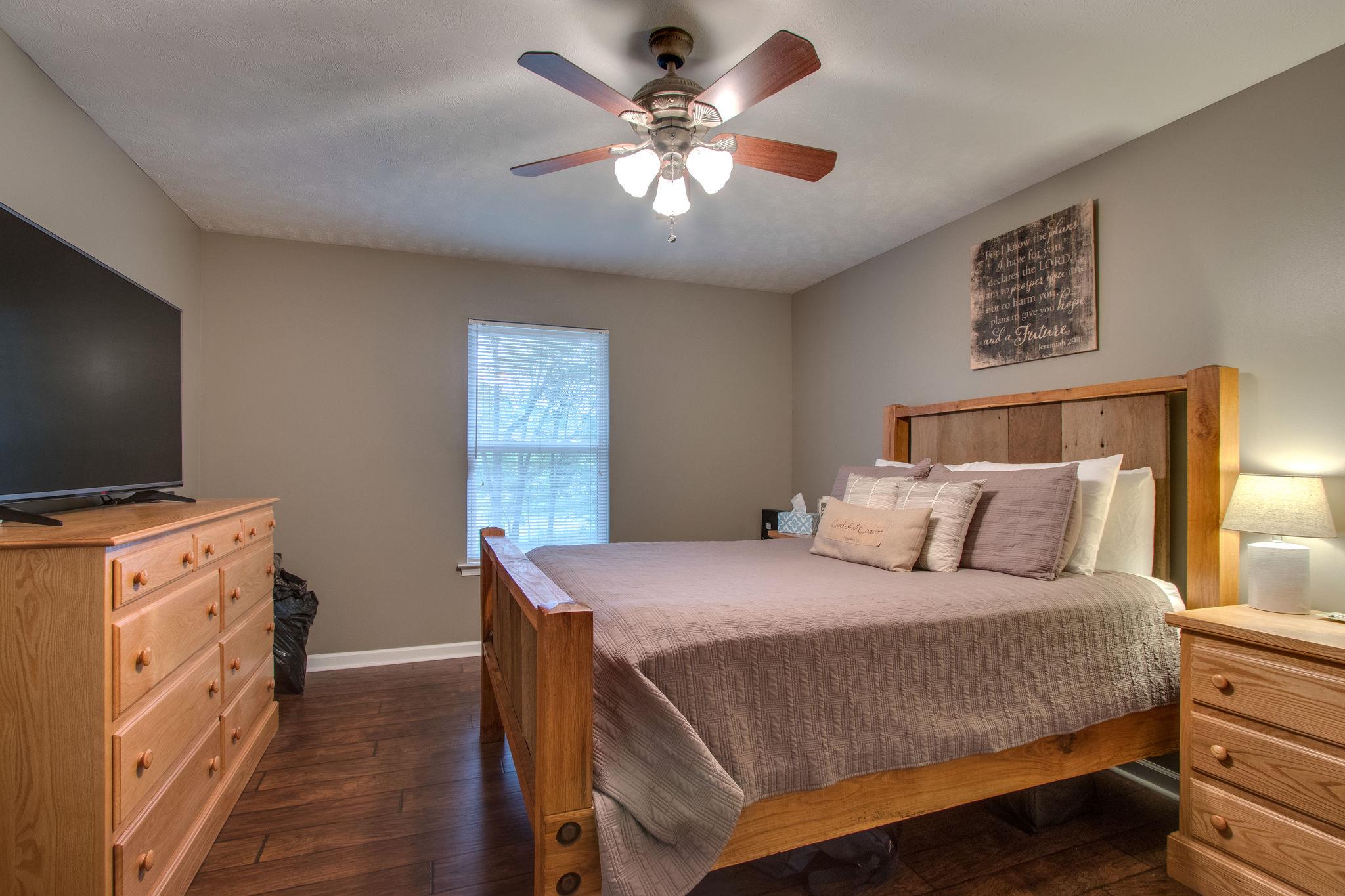2010 Belotes Ferry Road Lebanon, TN 37087 - Photo 17 of 27 a bedroom with a bed and a flat screen tv