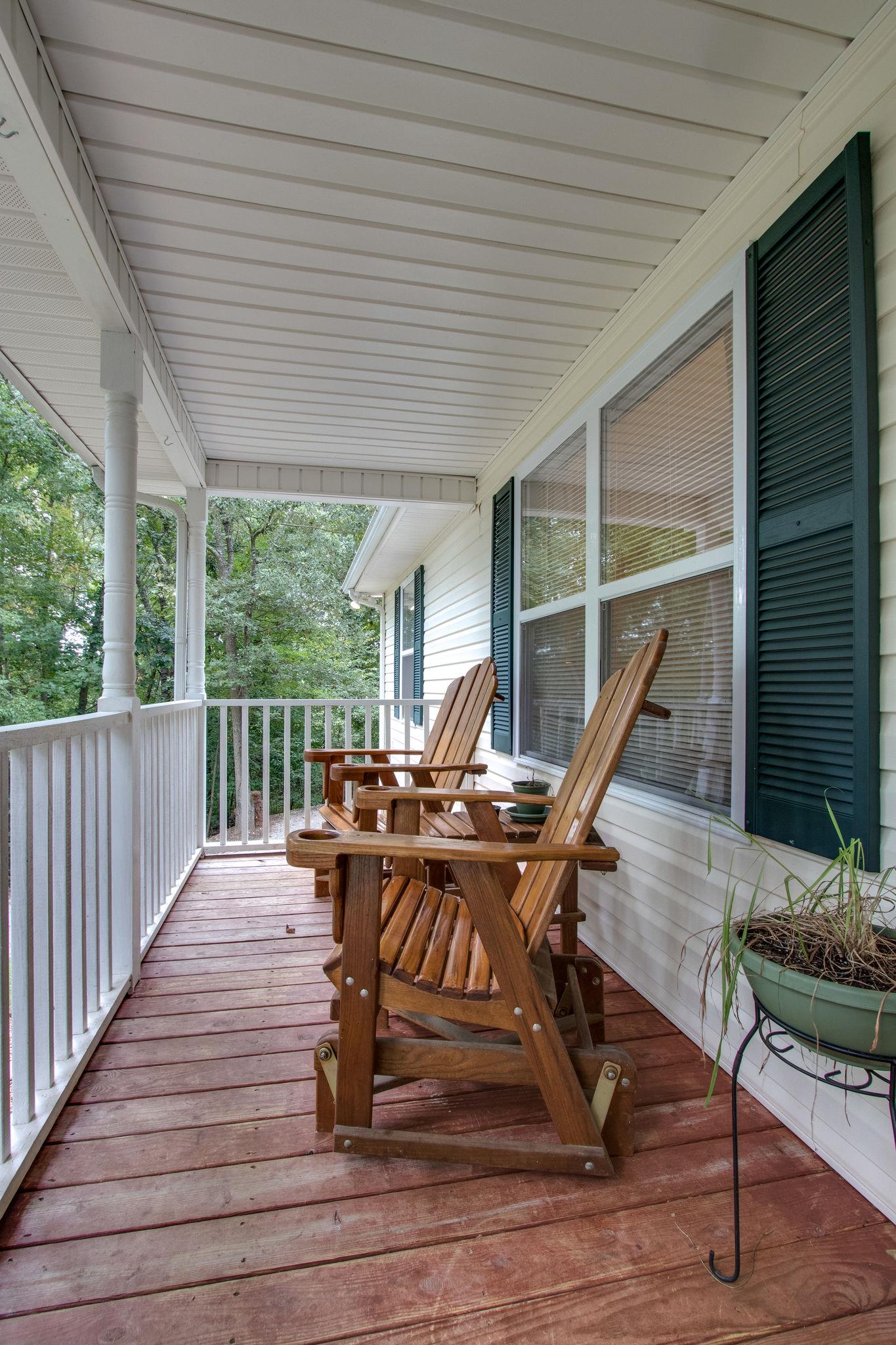 2010 Belotes Ferry Road Lebanon, TN 37087 - Photo 4 of 27 a view of a patio with wooden floor table and chairs