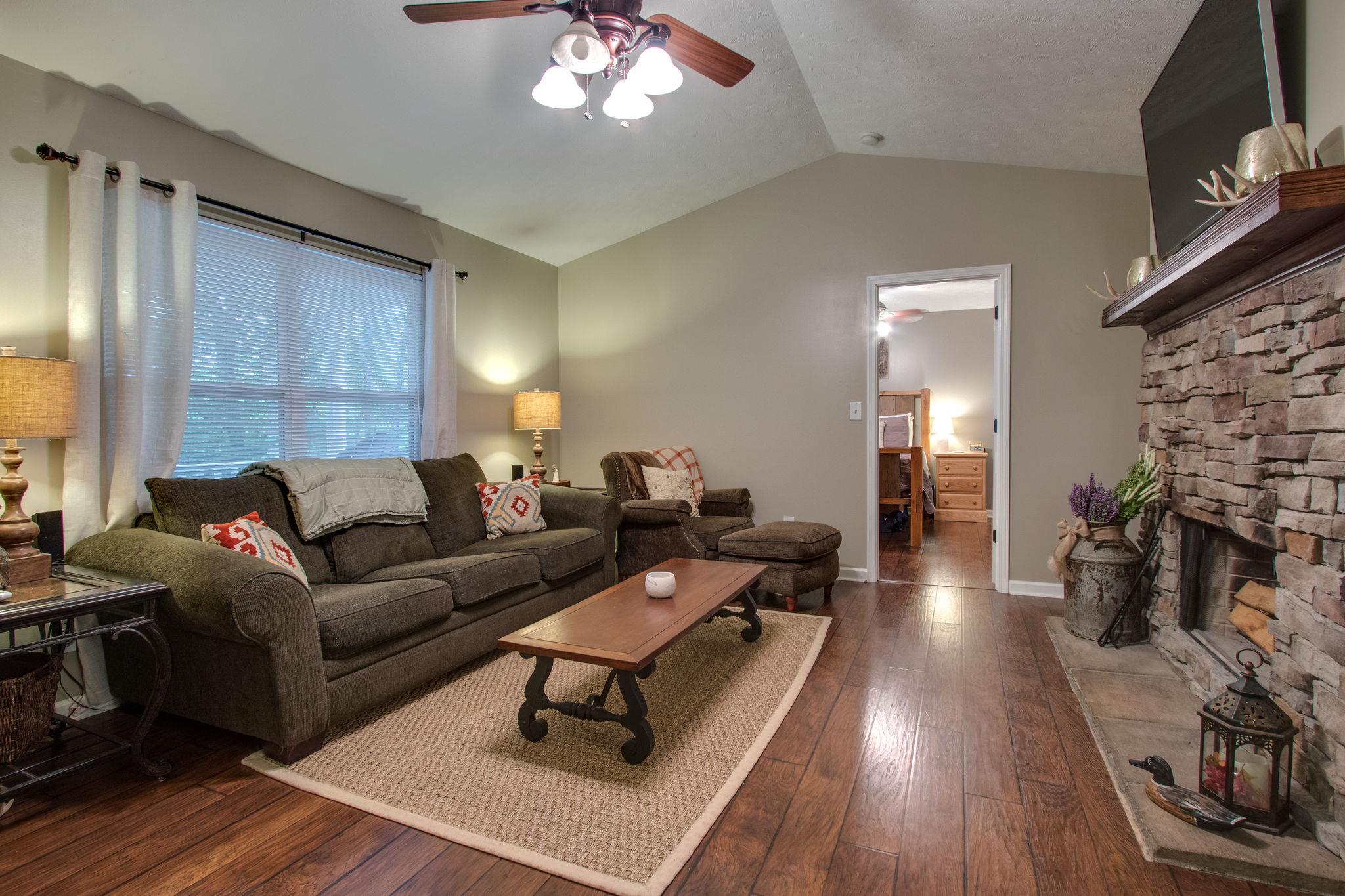 2010 Belotes Ferry Road Lebanon, TN 37087 - Photo 6 of 27 a living room with furniture a fireplace and wooden floor