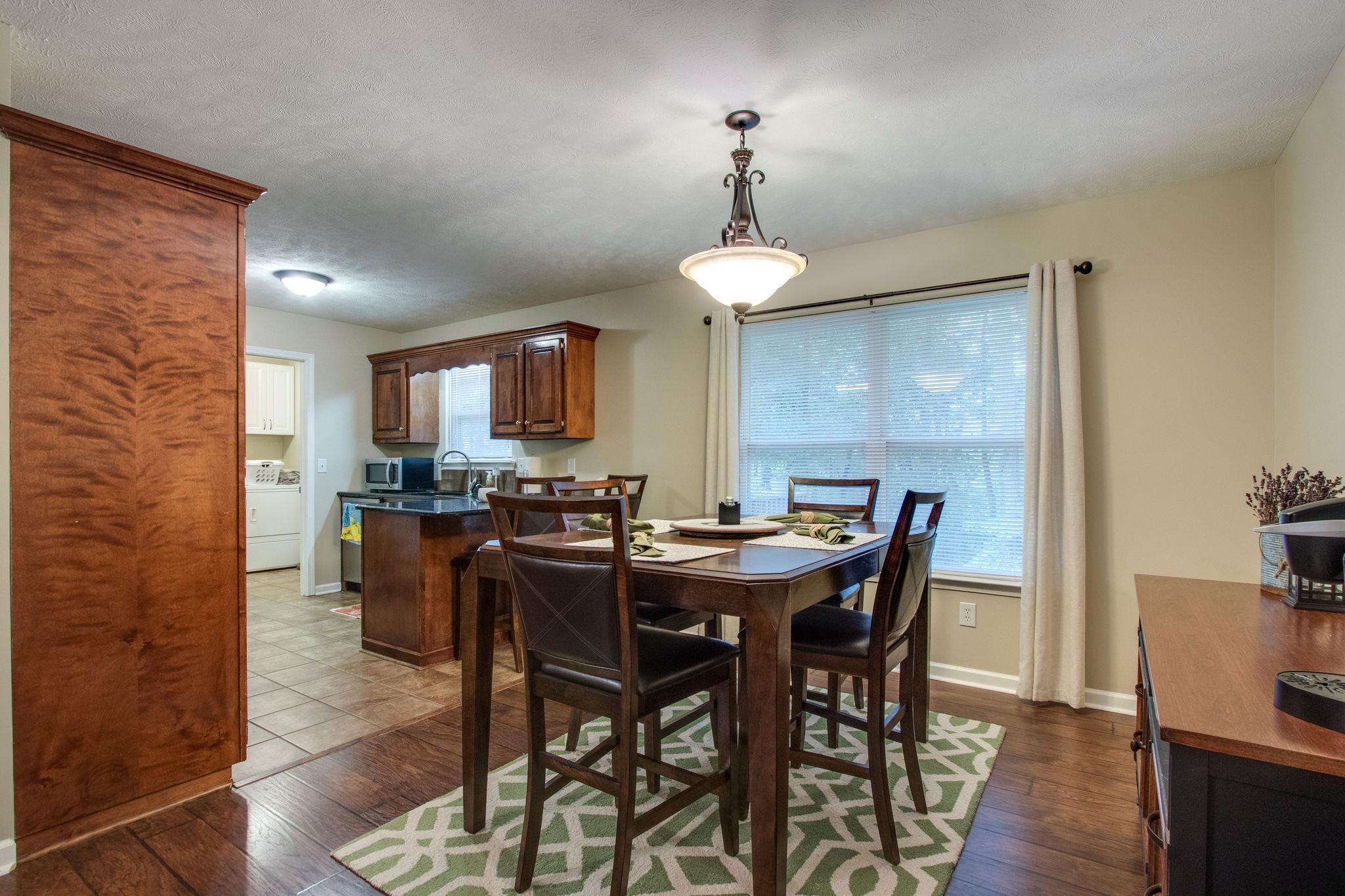 2010 Belotes Ferry Road Lebanon, TN 37087 - Photo 10 of 27 a view of a dining room with furniture and wooden floor