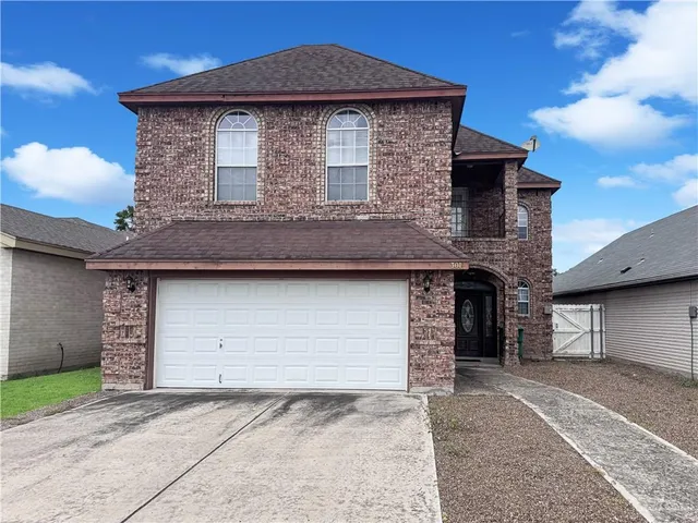 a front view of a house with garage