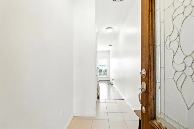 a bathroom with a glass shower door and a bathtub