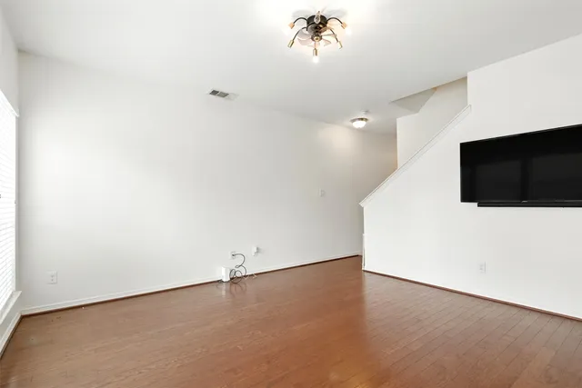 a view of a livingroom with wooden floor