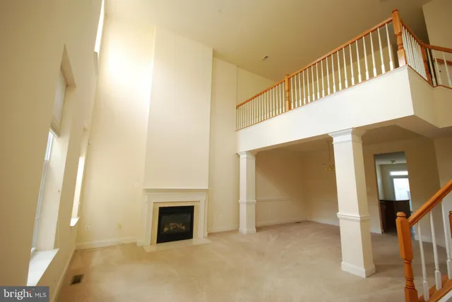 a view of a hallway with staircase