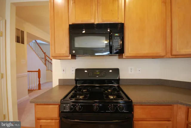a kitchen with a stove and a microwave