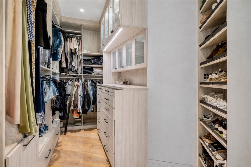 300 Pier 4 Blvd., Unit PHR Boston, MA 02210 - Photo 11 of 28 a view of walk in closet with clothes and shoes