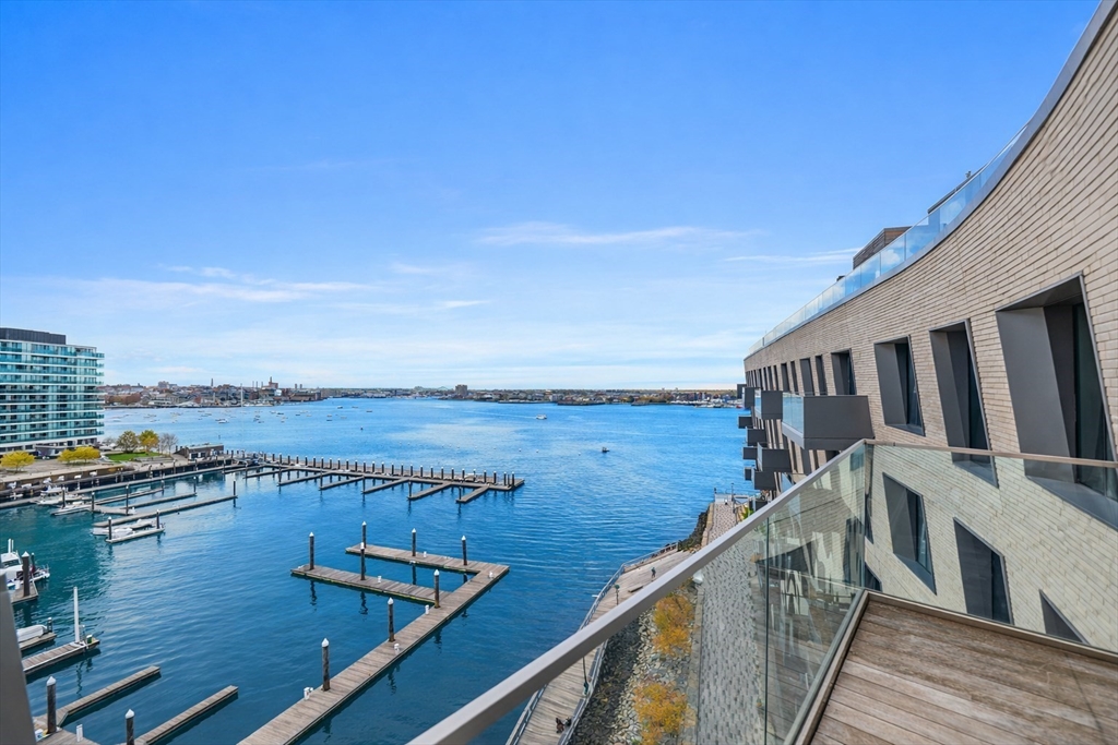 300 Pier 4 Blvd., Unit PHR Boston, MA 02210 - Photo 19 of 28 a view of a balcony with wooden floor and lake view